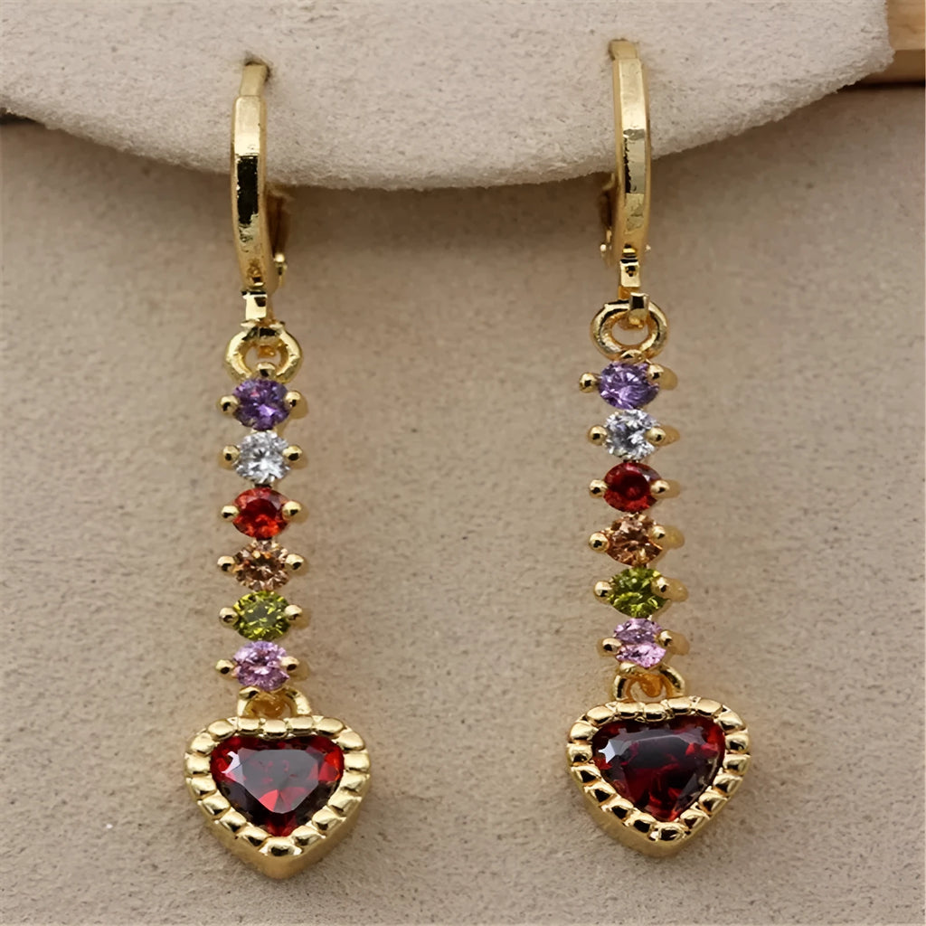 A pair of women's heart-shaped alloy earrings with a shiny electroplated gold finish.