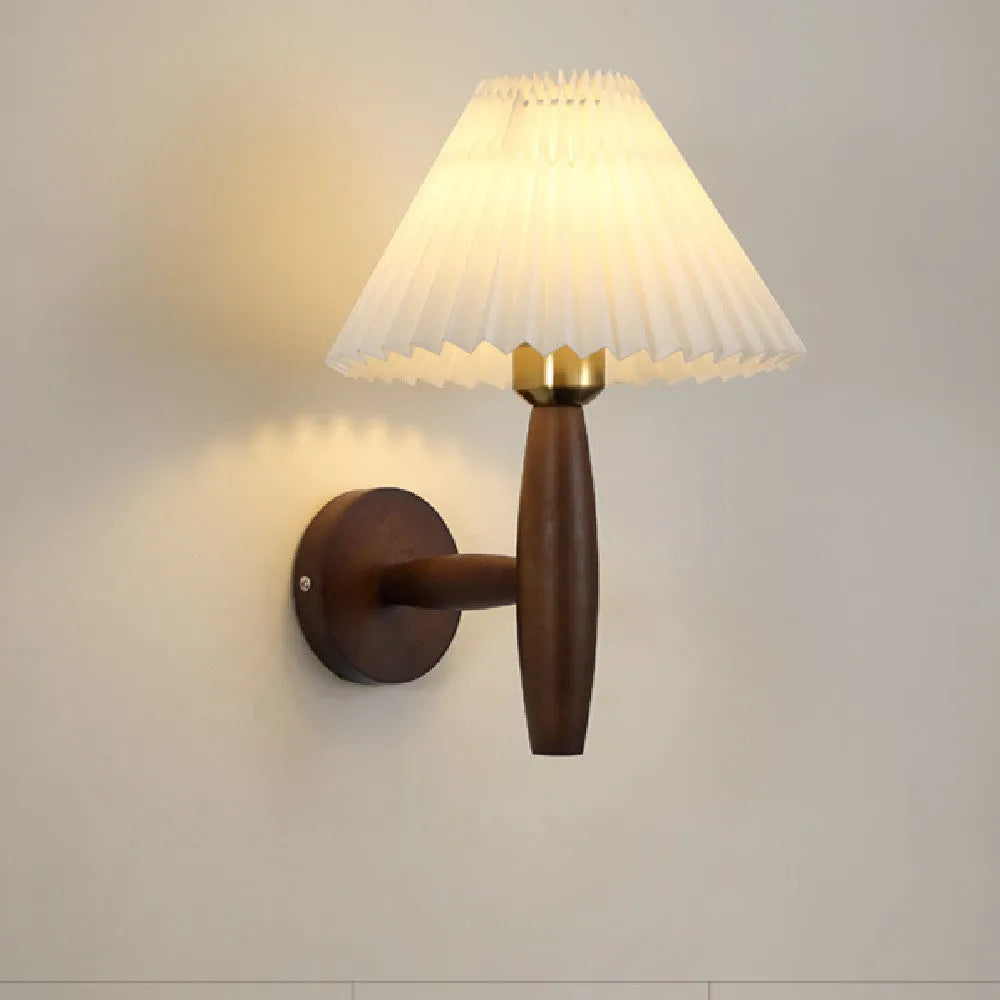 American retro walnut wood wall lamp with fabric shade on a wooden bedside table