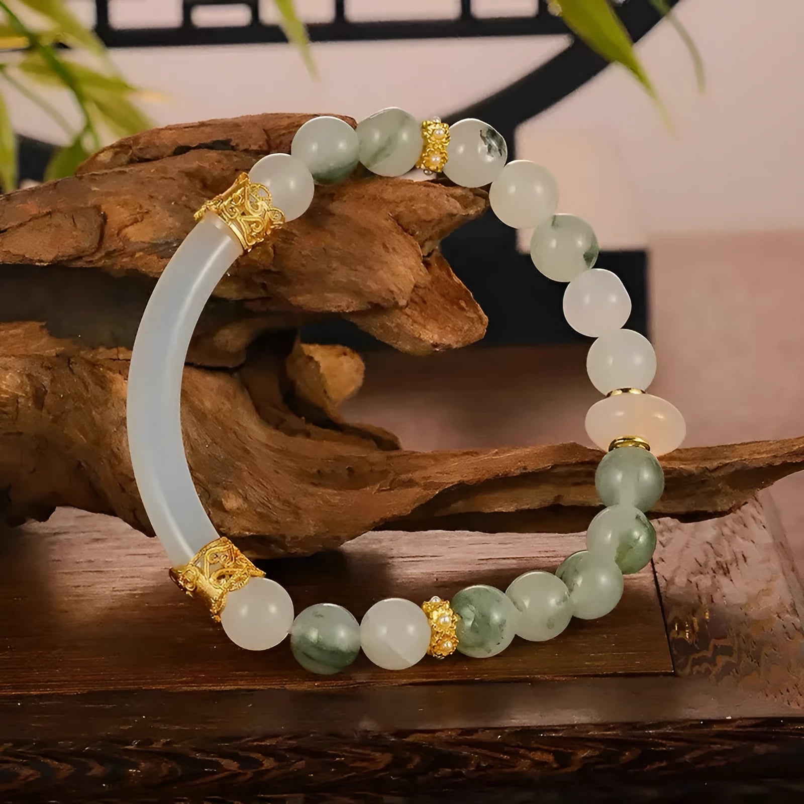 Emerald green jade bangle bracelet with floating flower design and round beads