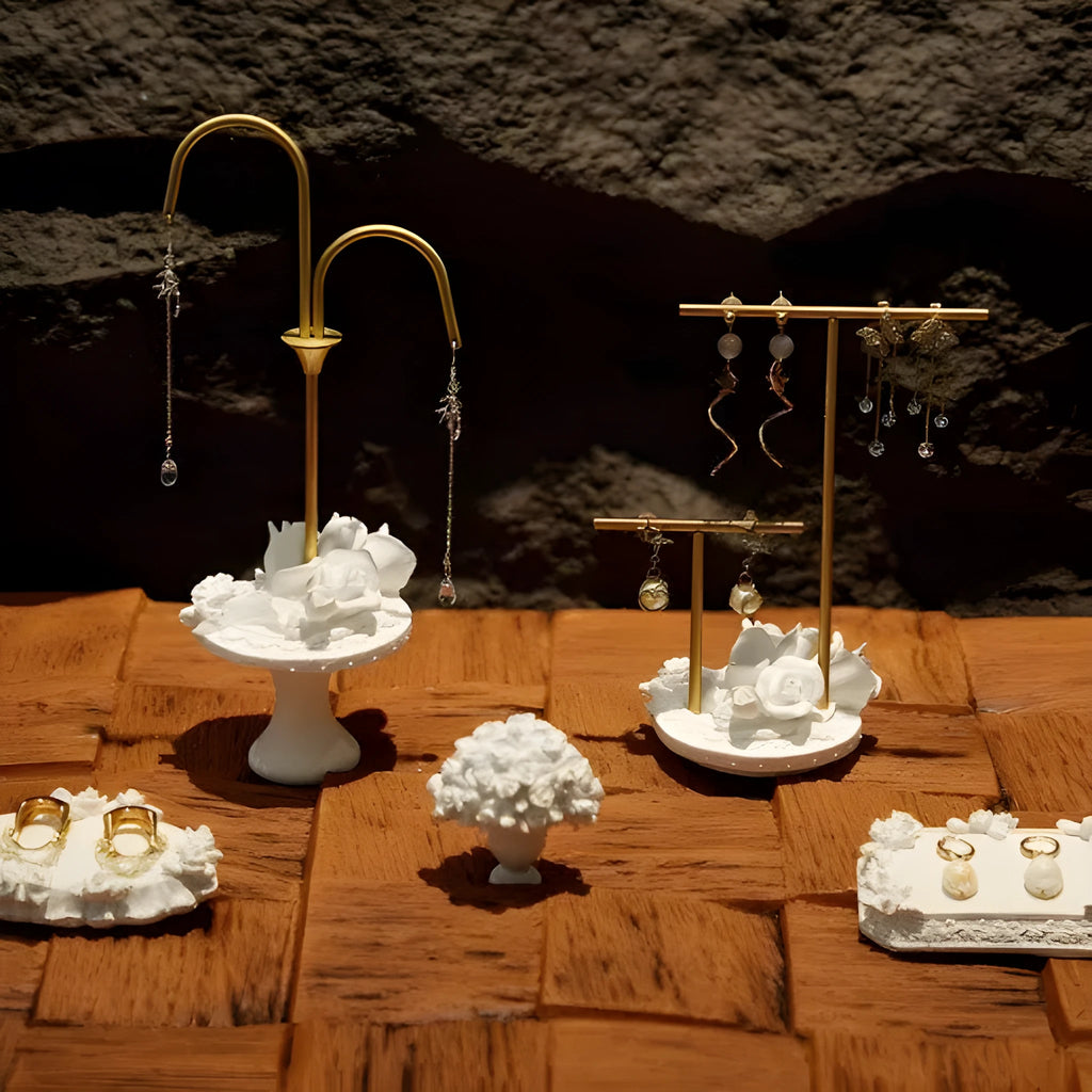 White gypsum rose ring storage tray with fabric coating on a dresser surface