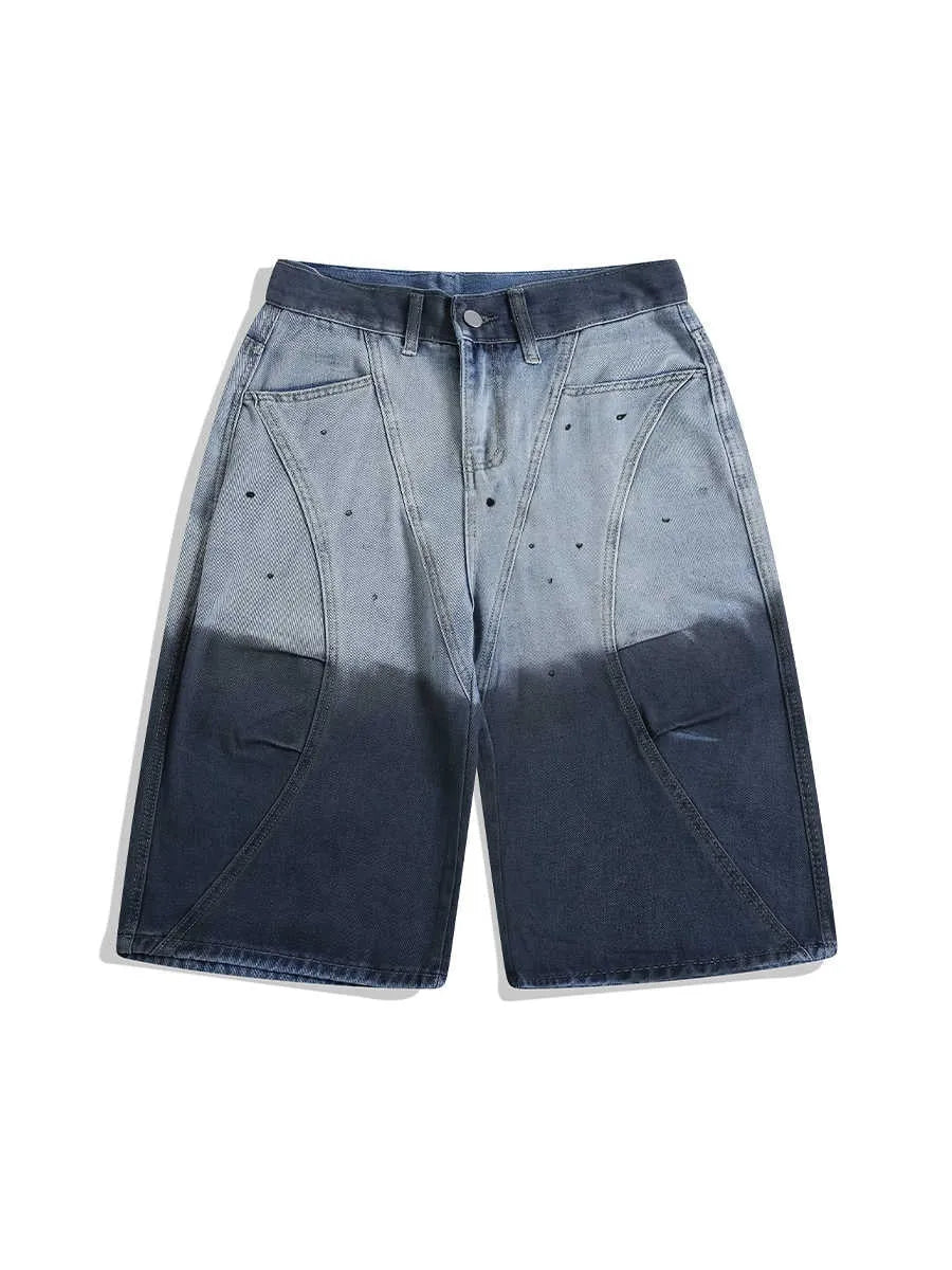 Loose fit blue tie-dye gradient cropped jeans on a hanger, showing washed-out colour and mid-waist design.