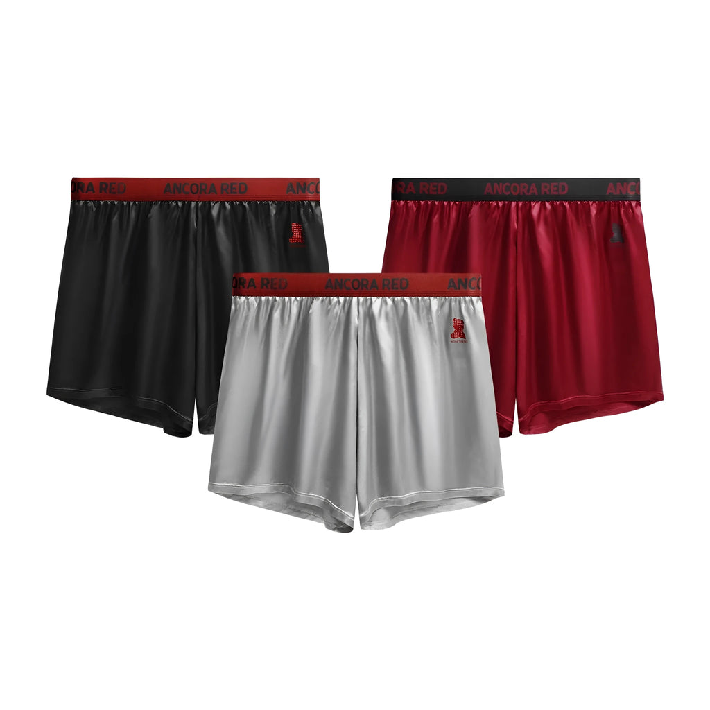 Solid colour men's boxer briefs in knitted polyester fabric showing mid waist design