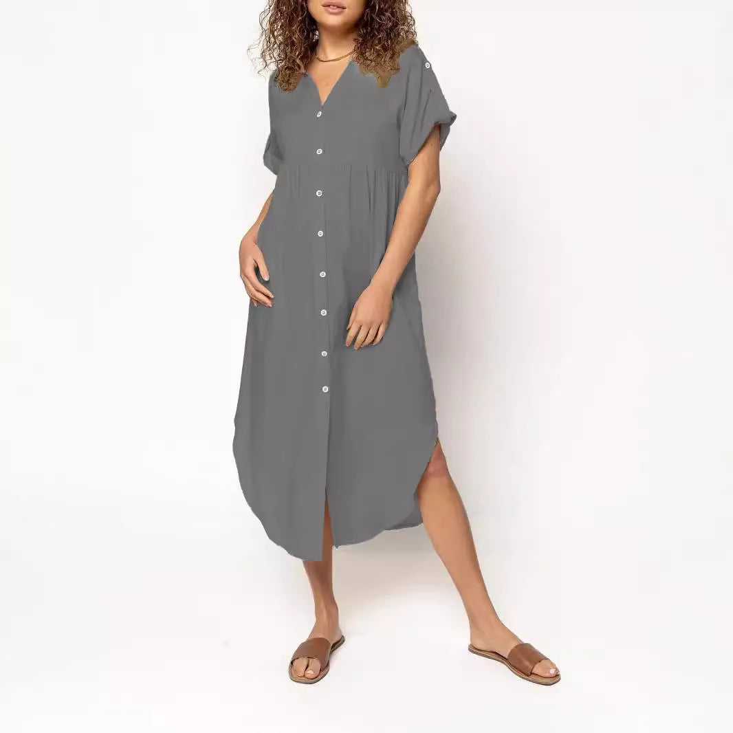 Casual solid colour mid-length dress with button front closure on a hanger.