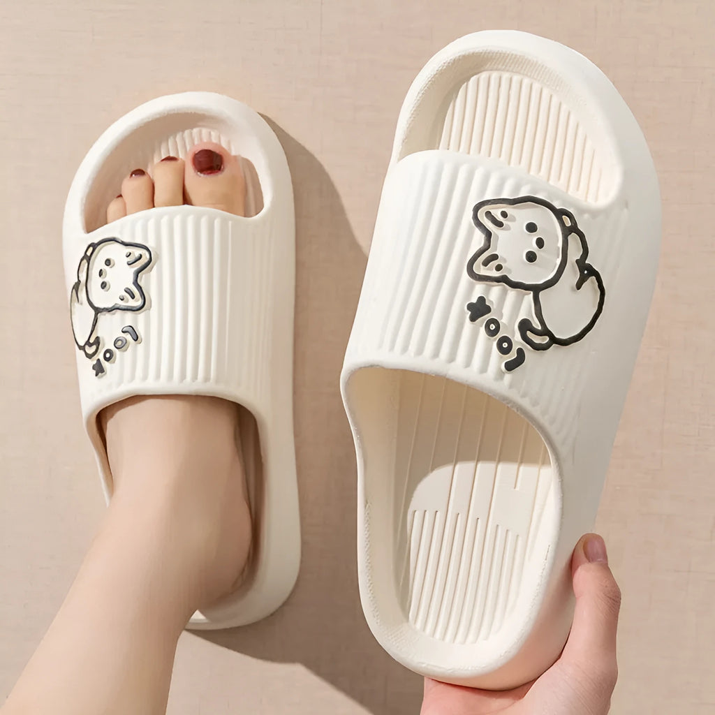 Women's green cat slippers with thick platform sole and flip-flop design.