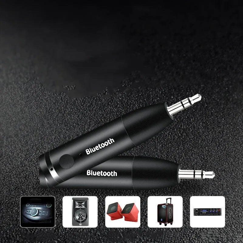 Black AUX Bluetooth 5.0 audio receiver for car stereo with USB cable.