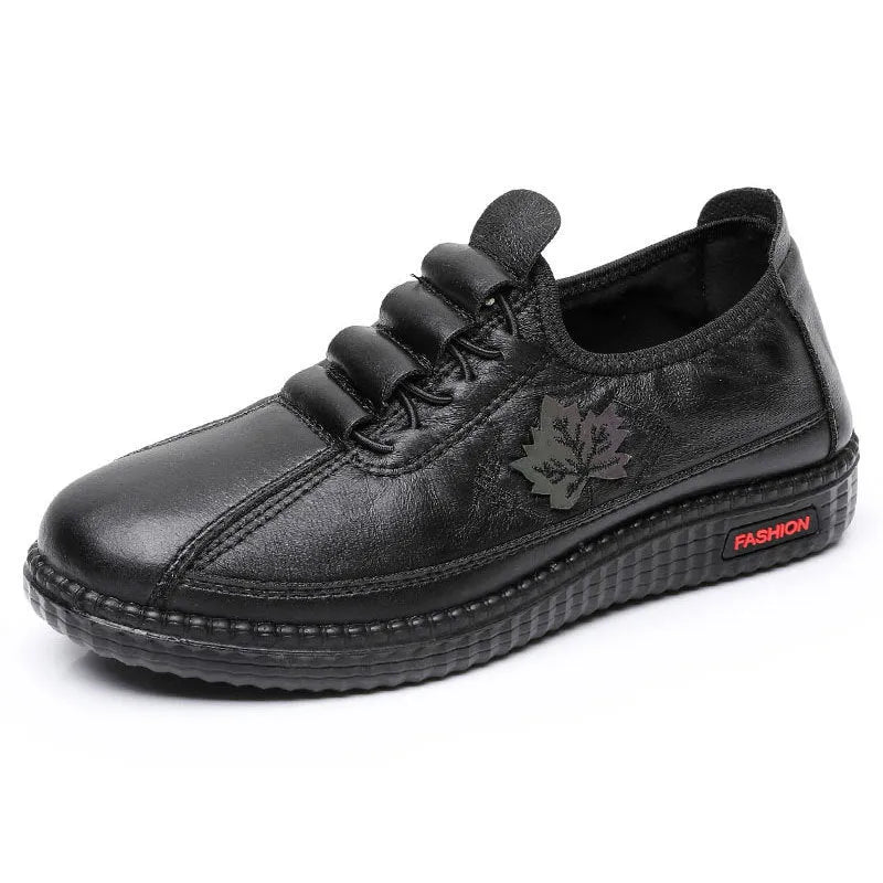 Plus size PU soft bottom slip-on mom shoes in black with leaf pattern, flat heel, and shallow mouth design