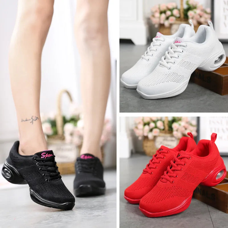 Women's white breathable mesh dance shoes with a lightweight PU sole on a studio floor.