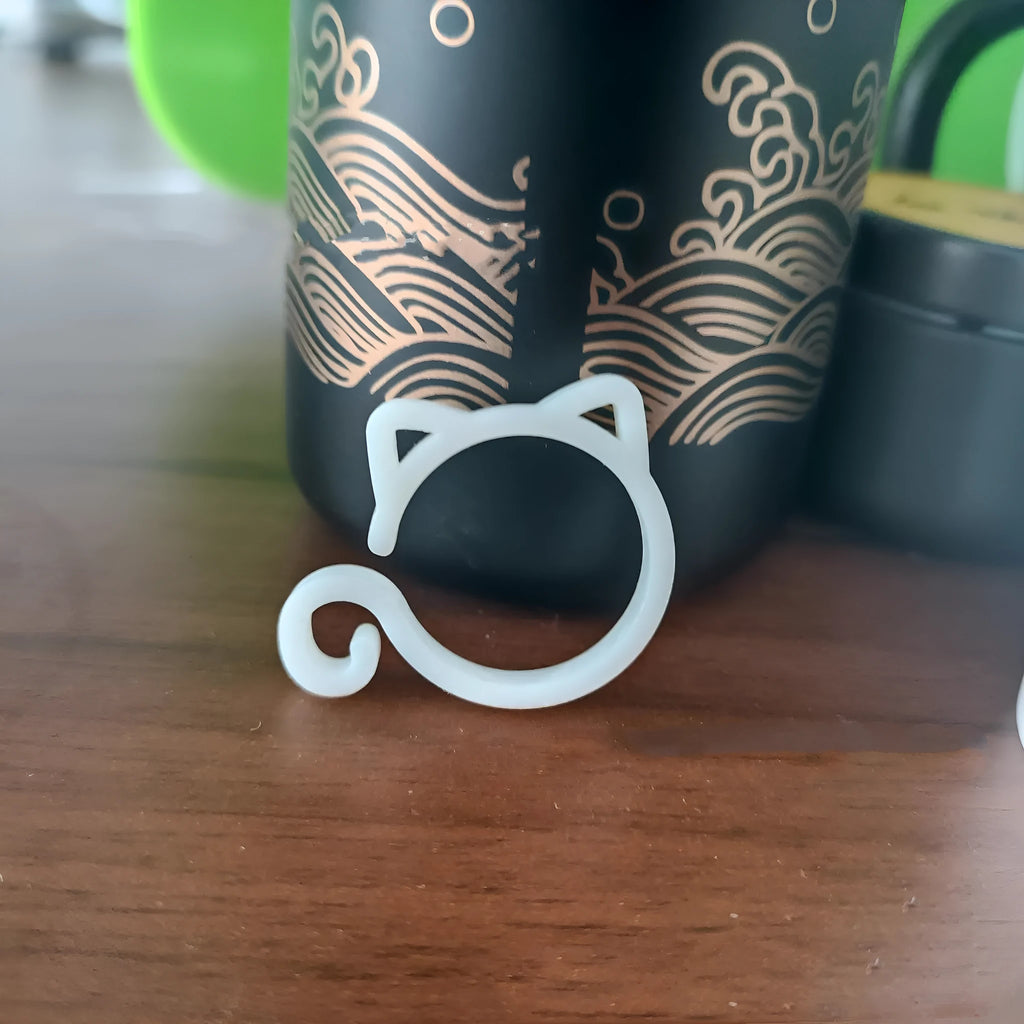 Small cat-shaped plastic plant clip in four colour options for indoor gardening support
