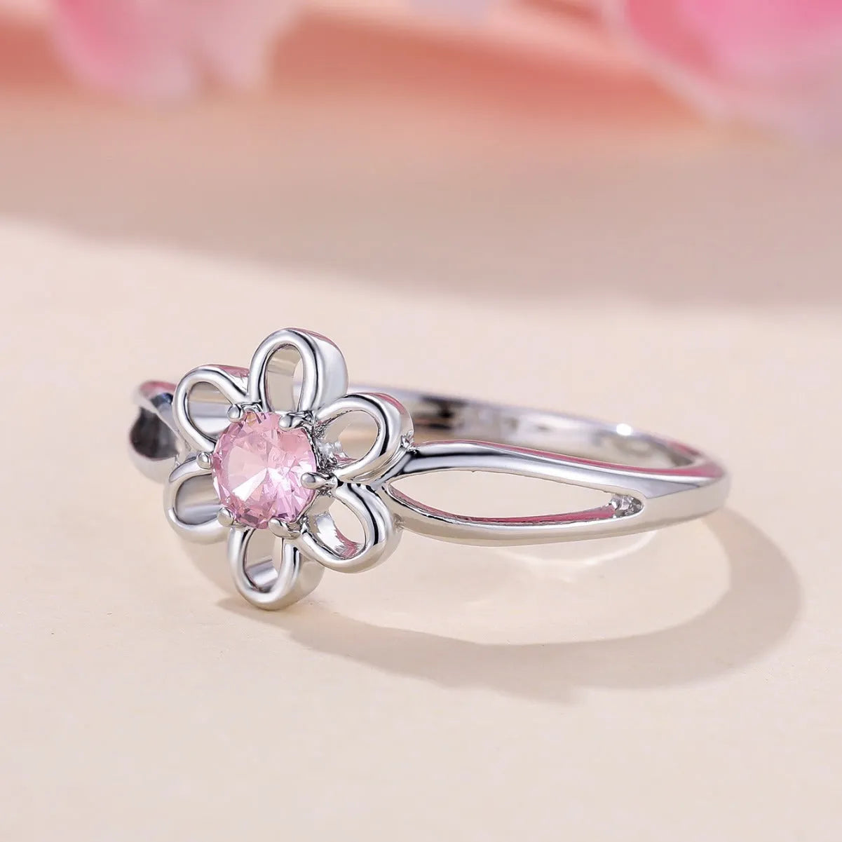 Women's hollow flower design ring in platinum pink diamond colour with white gold powder accents