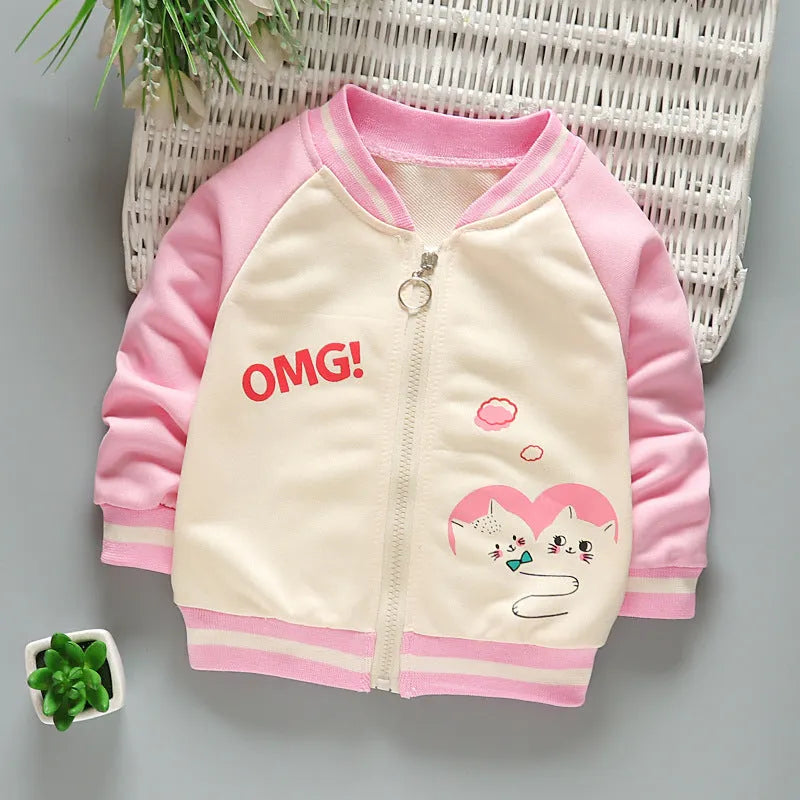 Children's Korean baseball jacket in beige with animal print, V-neck, long sleeves, non-hooded, on child.
