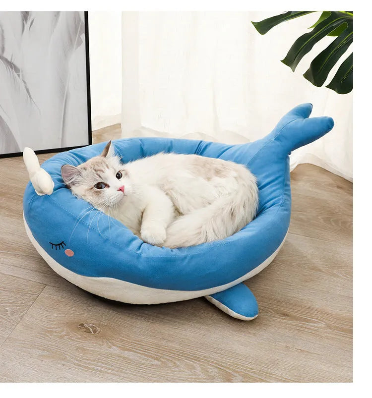 Blue duck-shaped fluffy pet bed for small dogs and cats on a floor