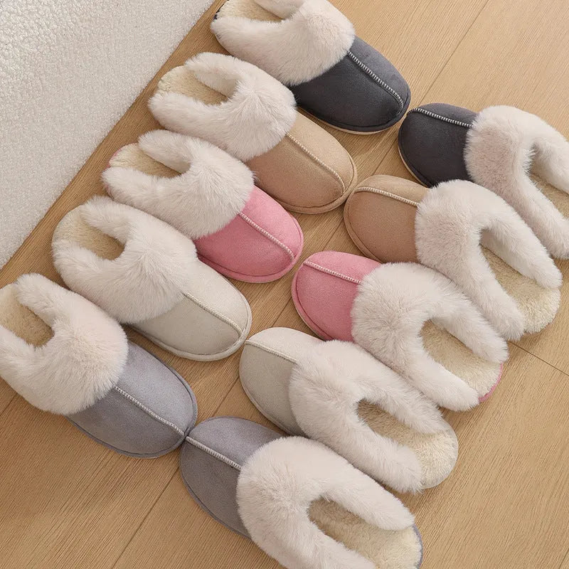 A pair of brown plush winter slippers with a round toe, flat heel, and non-slip PVC sole.