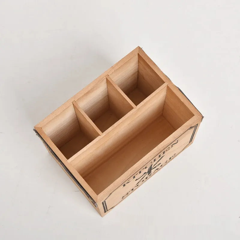 Open-top wooden kitchen storage box with internal grid divider for knives, forks, and chopsticks.