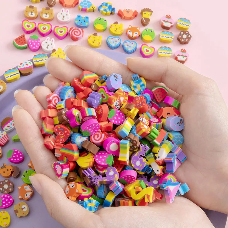 Assortment of 50 colourful cartoon-themed mini erasers including fruit, animal, and holiday designs.