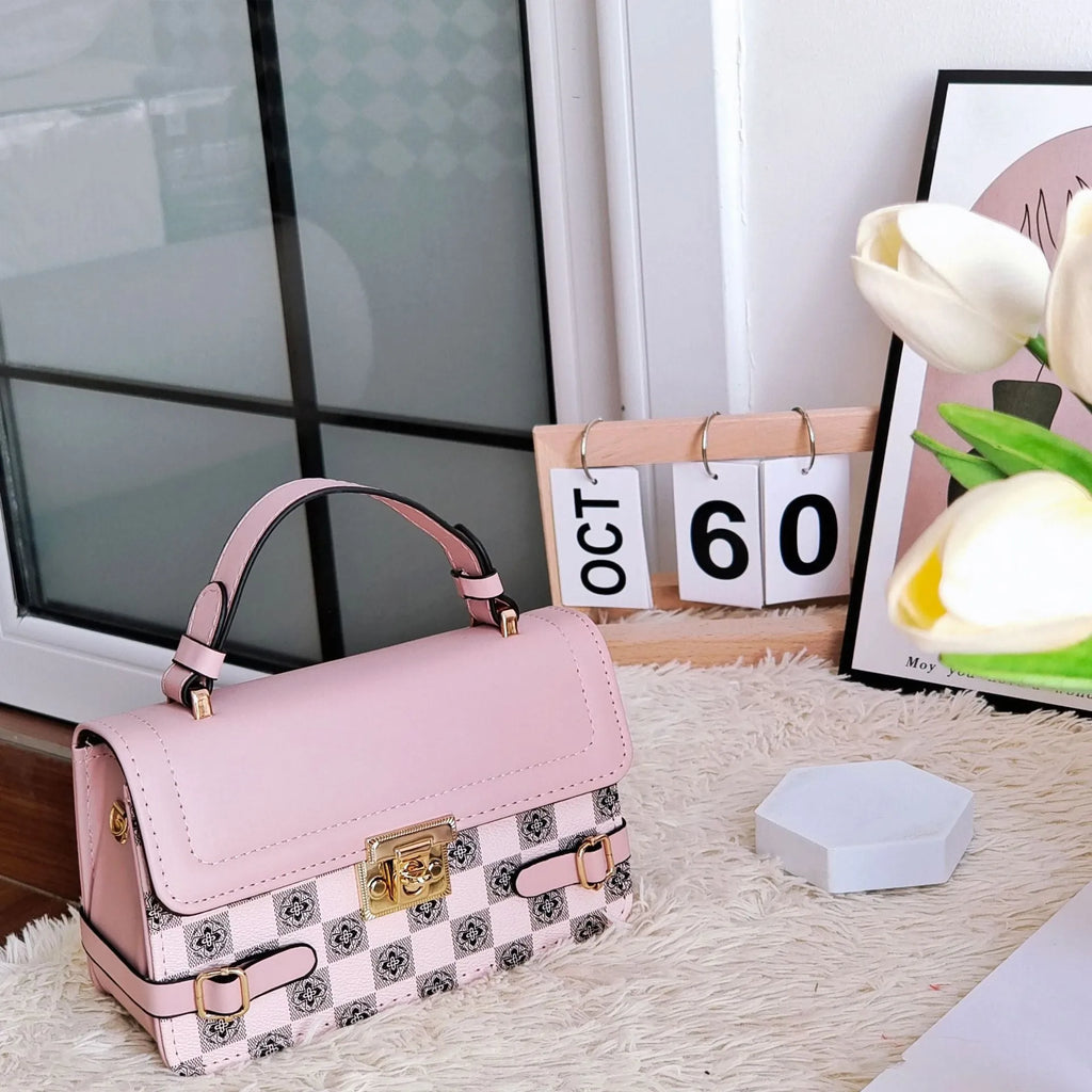 Small square retro pattern crossbody bag in PU leather with floral stitching.