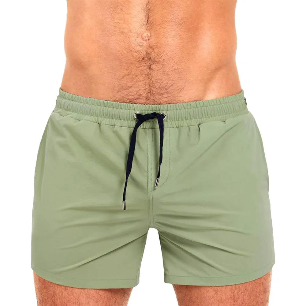 Solid colour sports shorts with mesh lining in Army Green, shown flat.