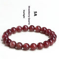 Natural strawberry quartz crystal bracelet with geometric beads showing starry inclusions
