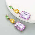 Geometric rhinestone earrings in a minimalist design with round shape, available in three colours
