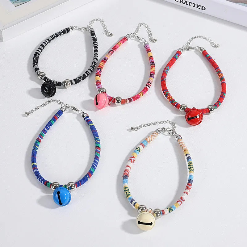 Coloured ethnic pattern adjustable pet collar with small bell for cats and dogs.