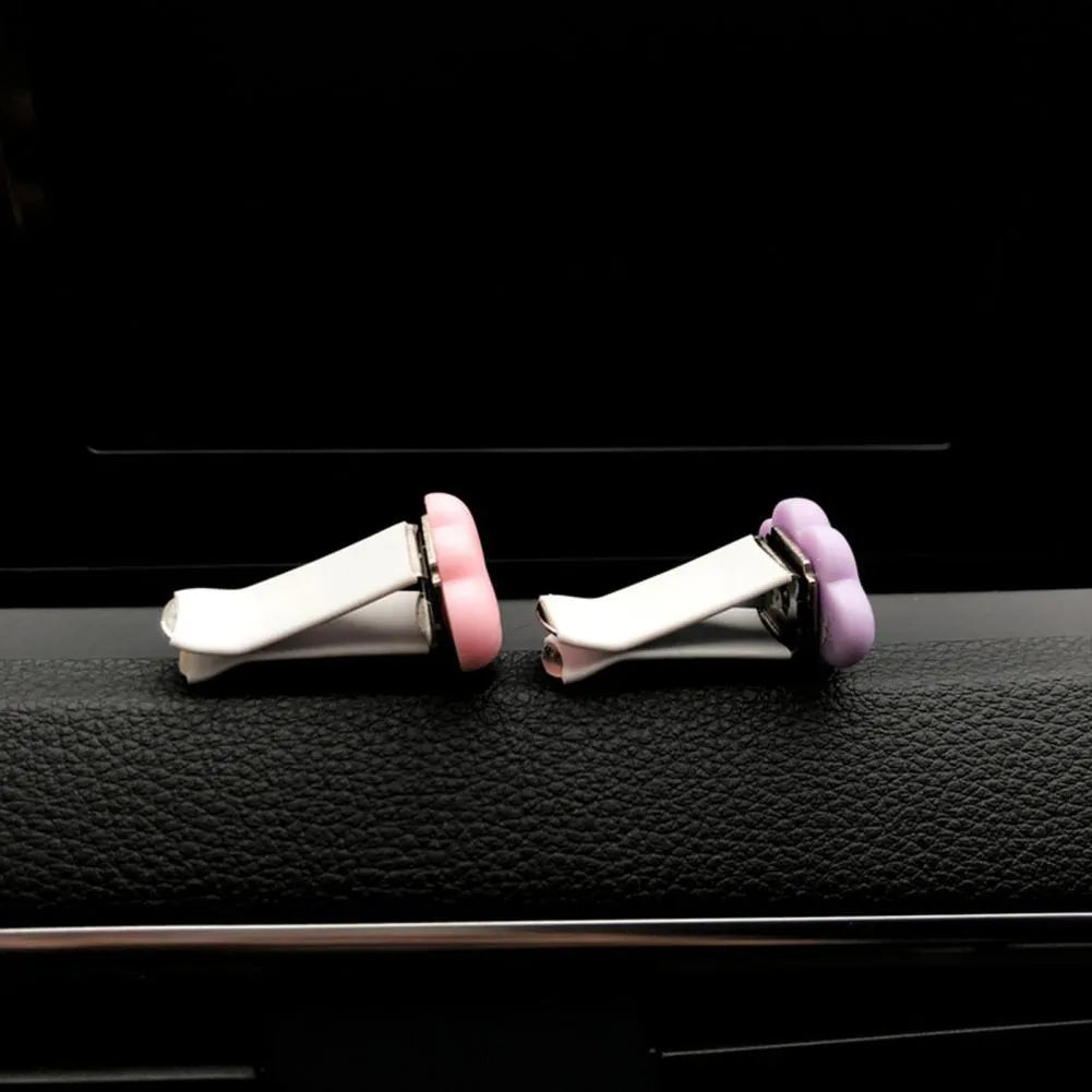 Resin cartoon Baiyun cloud car air freshener clip in light green, shown attached to a car air vent.