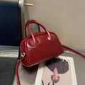 Genuine leather mini bowling bag in pillow shape, top grain leather, 24cm, with single strap, five colour options