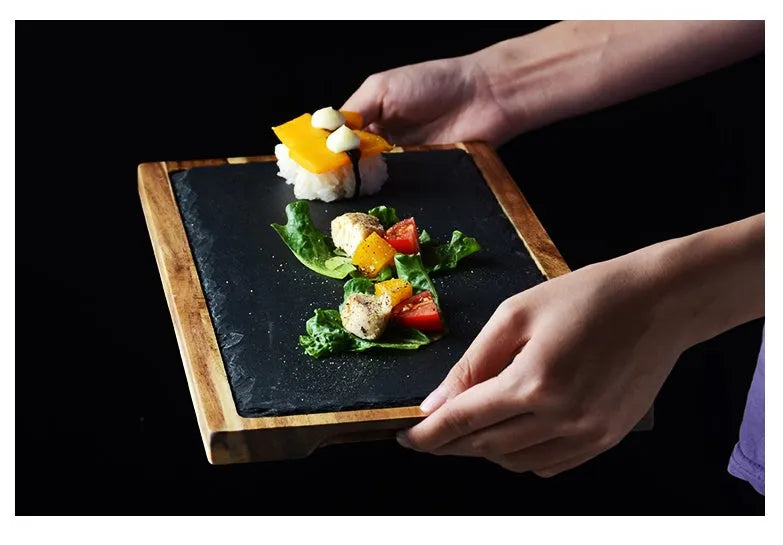 Black wooden pizza dish made from acacia wood and stone, multi-colour sets, on a table