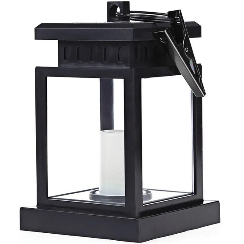 Solar LED candle light with black plastic shade, monocrystalline silicon panel, and IP44 waterproof rating for outdoor garden use