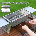 Small foldable portable charcoal grill with 34cm circular cooking surface collapsed for compact storage