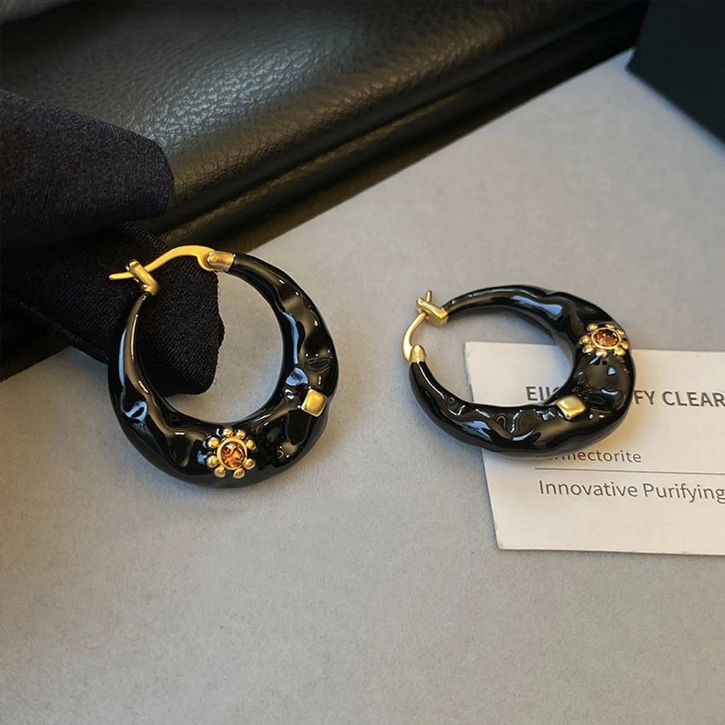 Hong Kong style retro ear studs with alloy construction and black rhinestone detailing