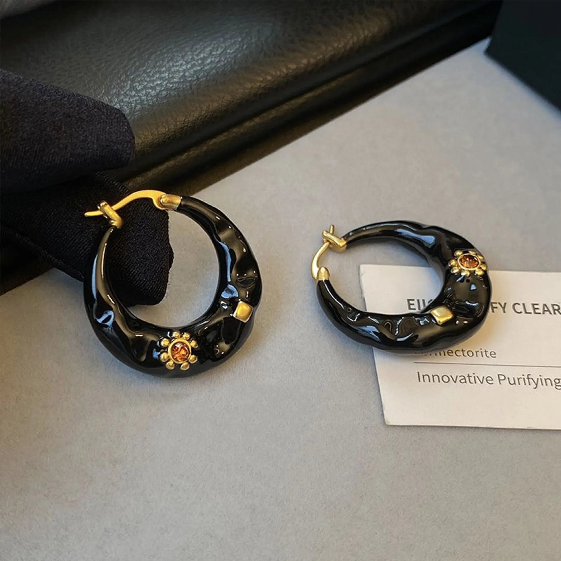 Hong Kong style retro ear studs with alloy construction and black rhinestone detailing
