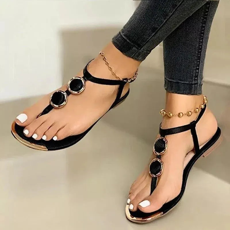 Women's flat sandals with round toe, metal buckle detail, artificial PU upper, in white colour