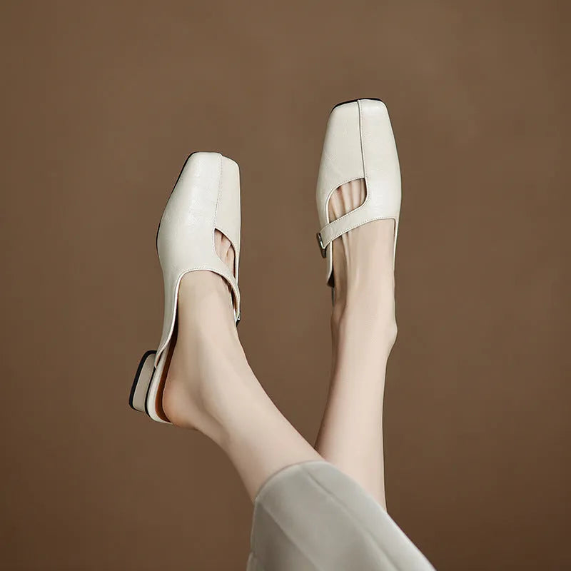 British style square head outdoor slippers in black, beige and silver colours with a low heel and rubber sole.
