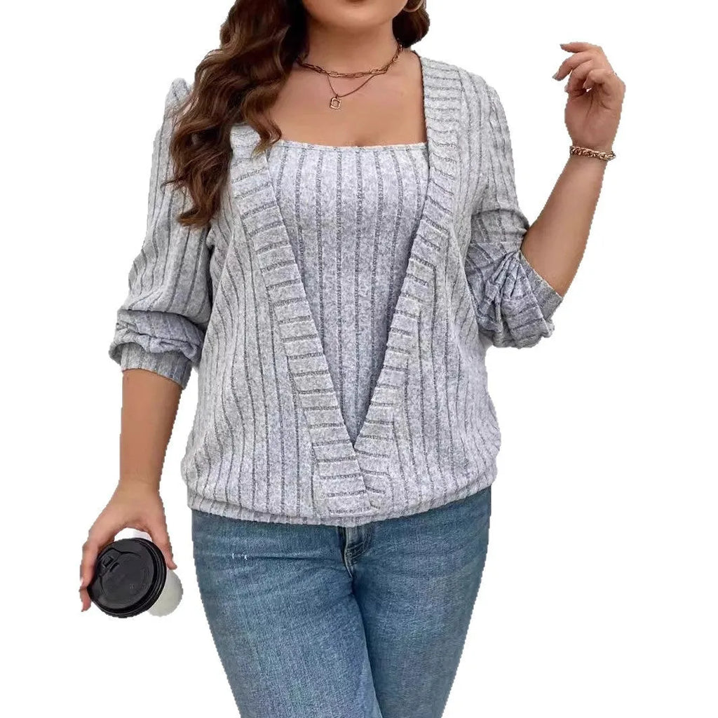 Women's solid colour false two-piece suit with V-neck and long sleeves in polyester rib fabric.