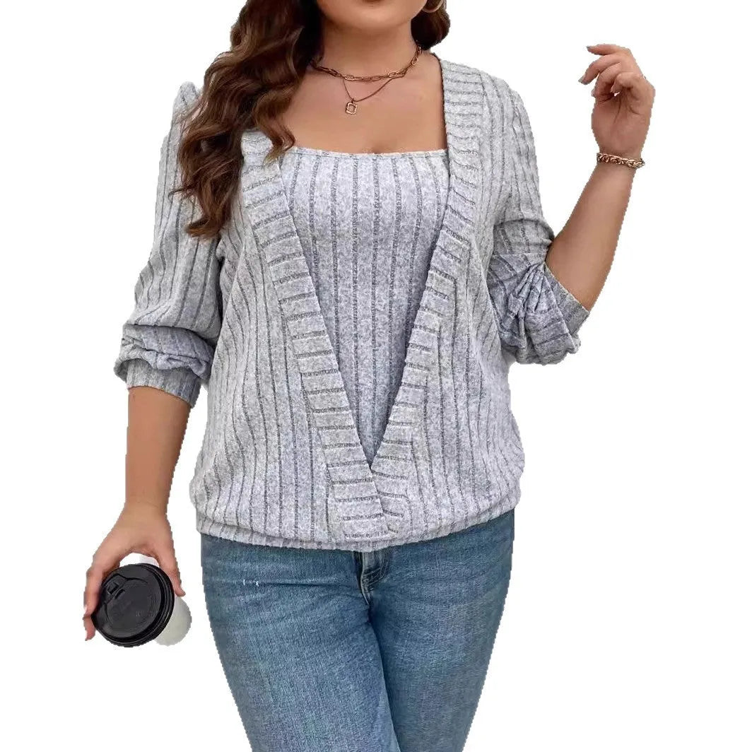Women's solid colour false two-piece suit with V-neck and long sleeves in polyester rib fabric.