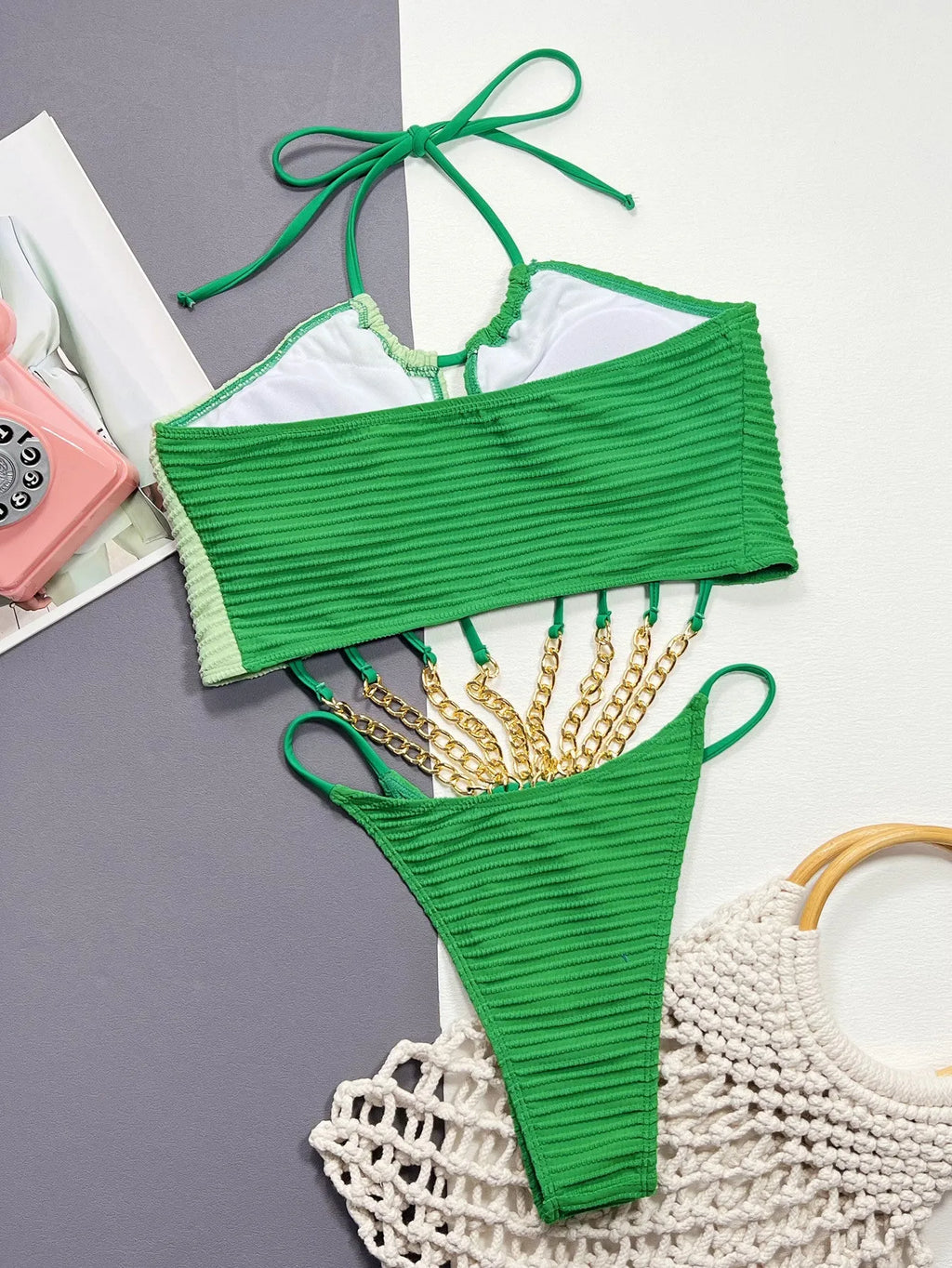 Green women's one-piece swimsuit with hollow design detail in polyester fabric