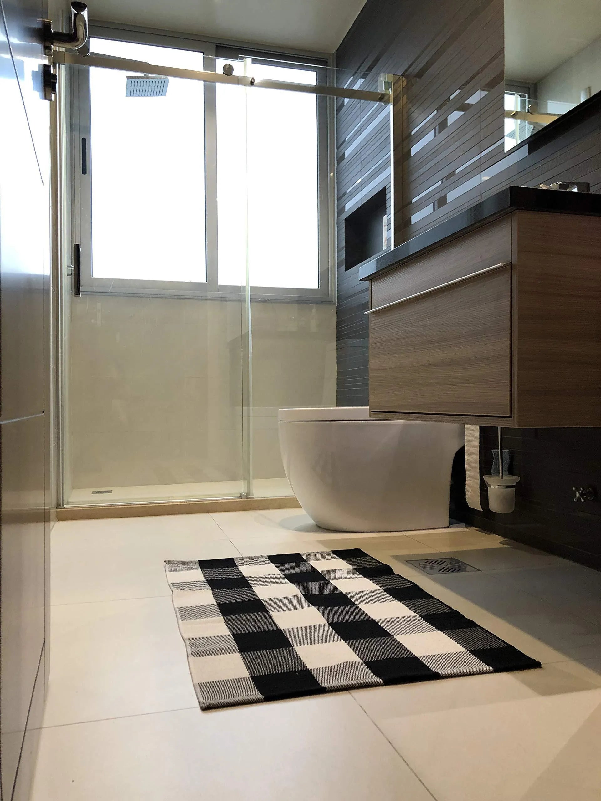 Cotton buffalo plaid rug in classic pattern on a light floor, showing non-slip backing