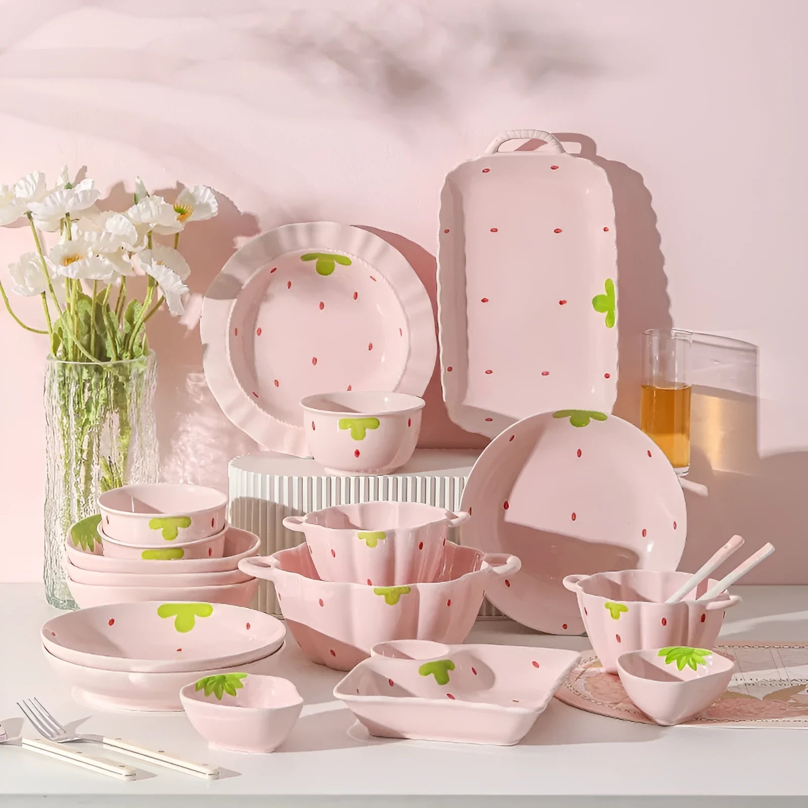 Cute strawberry-themed porcelain dinnerware set with flower bowl, straw hat plate, disc, and twist spoon.