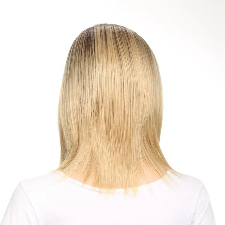 Short straight gold wig 16 inch length on a mannequin head for display