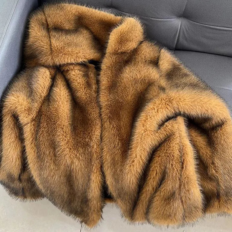 Silver grey women's loose-fit mid-length artificial fur coat on a hanger