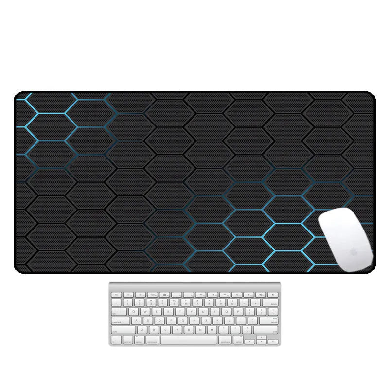 Large rectangular desk mouse pad with colourful printed pattern on natural rubber non-slip base.