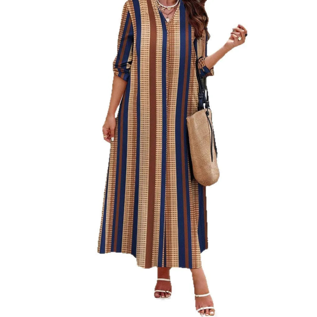 Camel coloured women's vertical striped V-neck long dress with long sleeves and an A-line skirt.