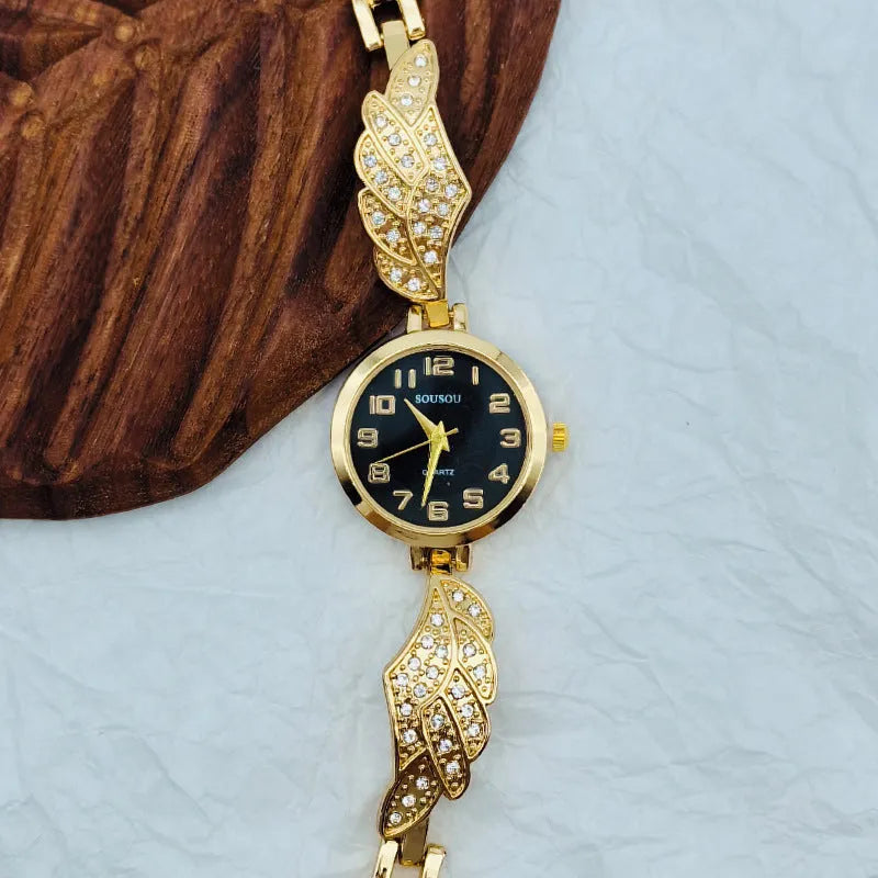 Women's stainless steel watch with round dial showing gold face colour option on wrist.