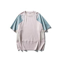Men's loose blue patchwork short sleeve t-shirt on a hanger.