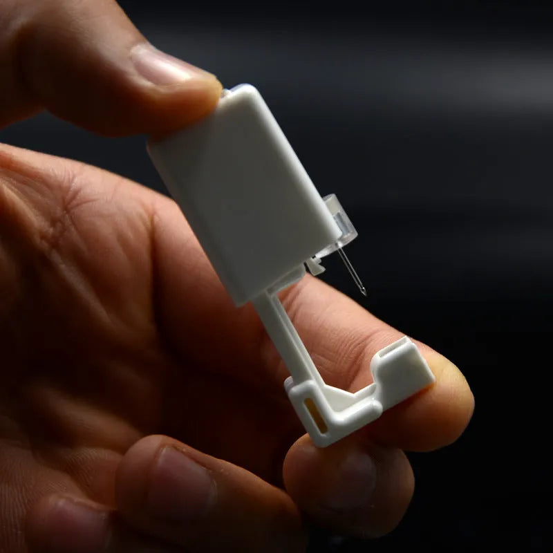 Disposable ear piercing gun with built-in crown stud in 316L stainless steel with zirconium inlay