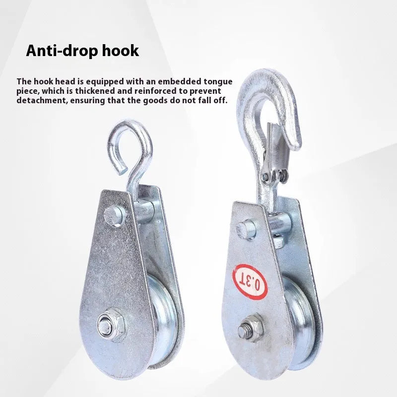 Red industrial single sheave lifting pulley with a forged steel hook and safety latch.