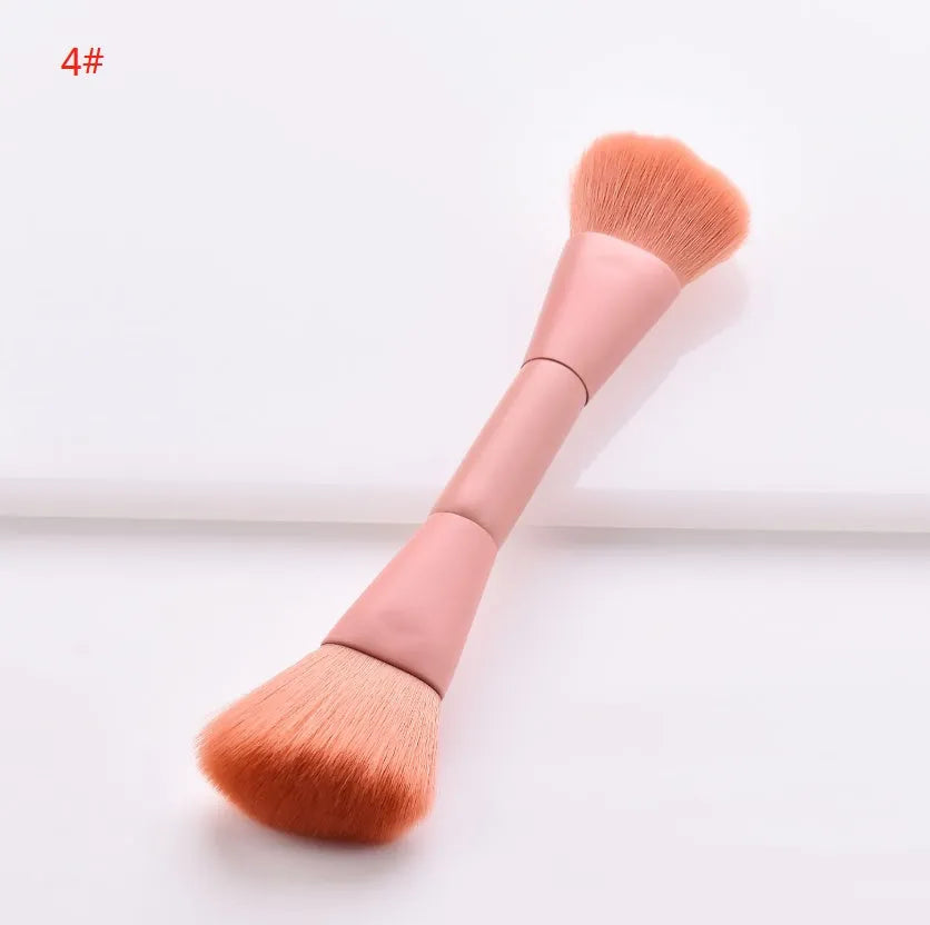 Ten cosmetic makeup brushes with wooden handles arranged showing various brush head shapes and sizes