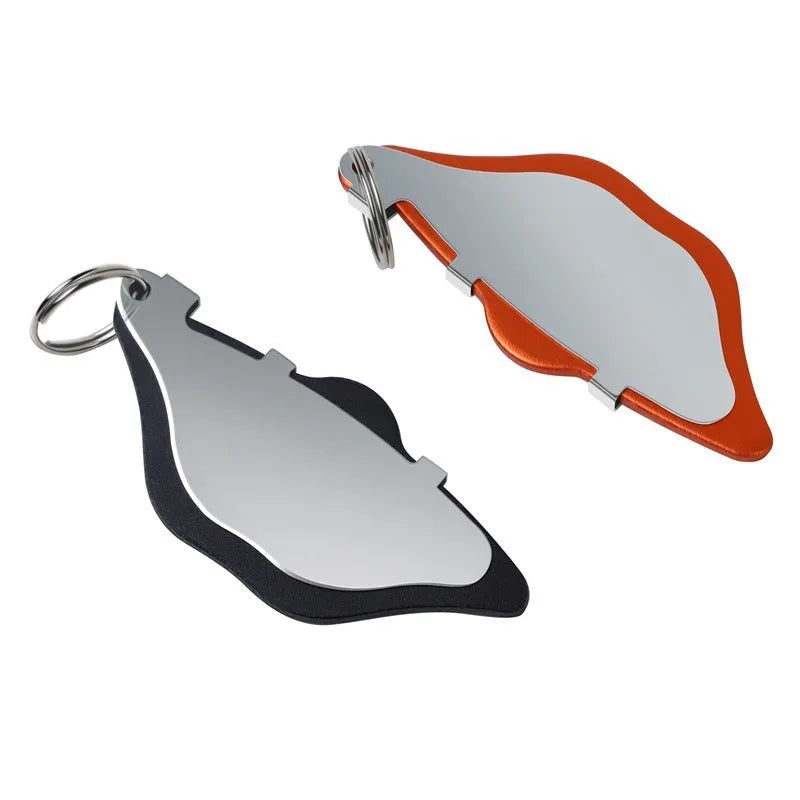Mountain bike disc brake linings in black and orange colours with adjustment flap