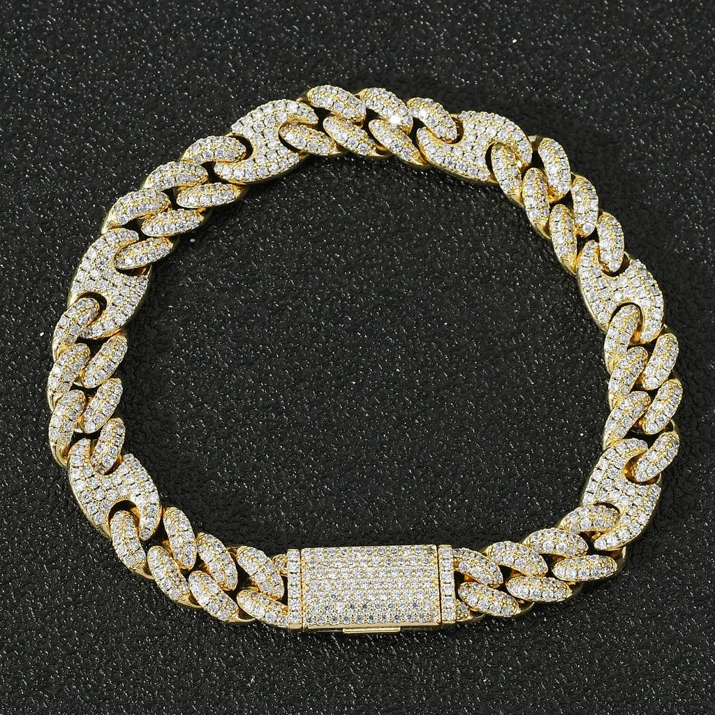 Micro inlaid zircon Cuban chain hip hop bracelet in gold and silver on a flat surface