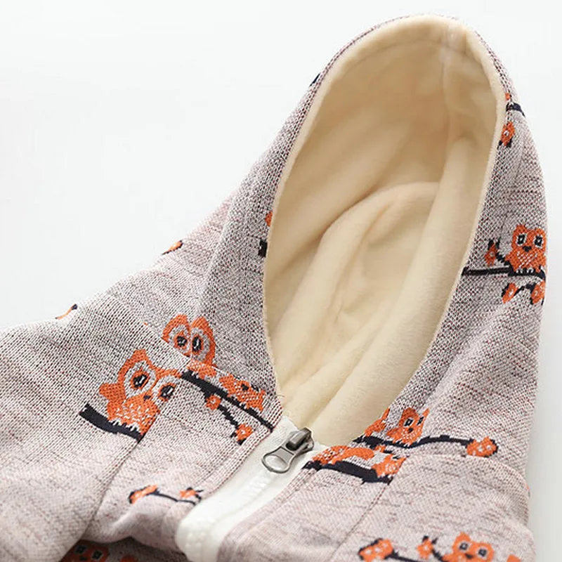 Blue patterned dog sweater with front zip on a small dog