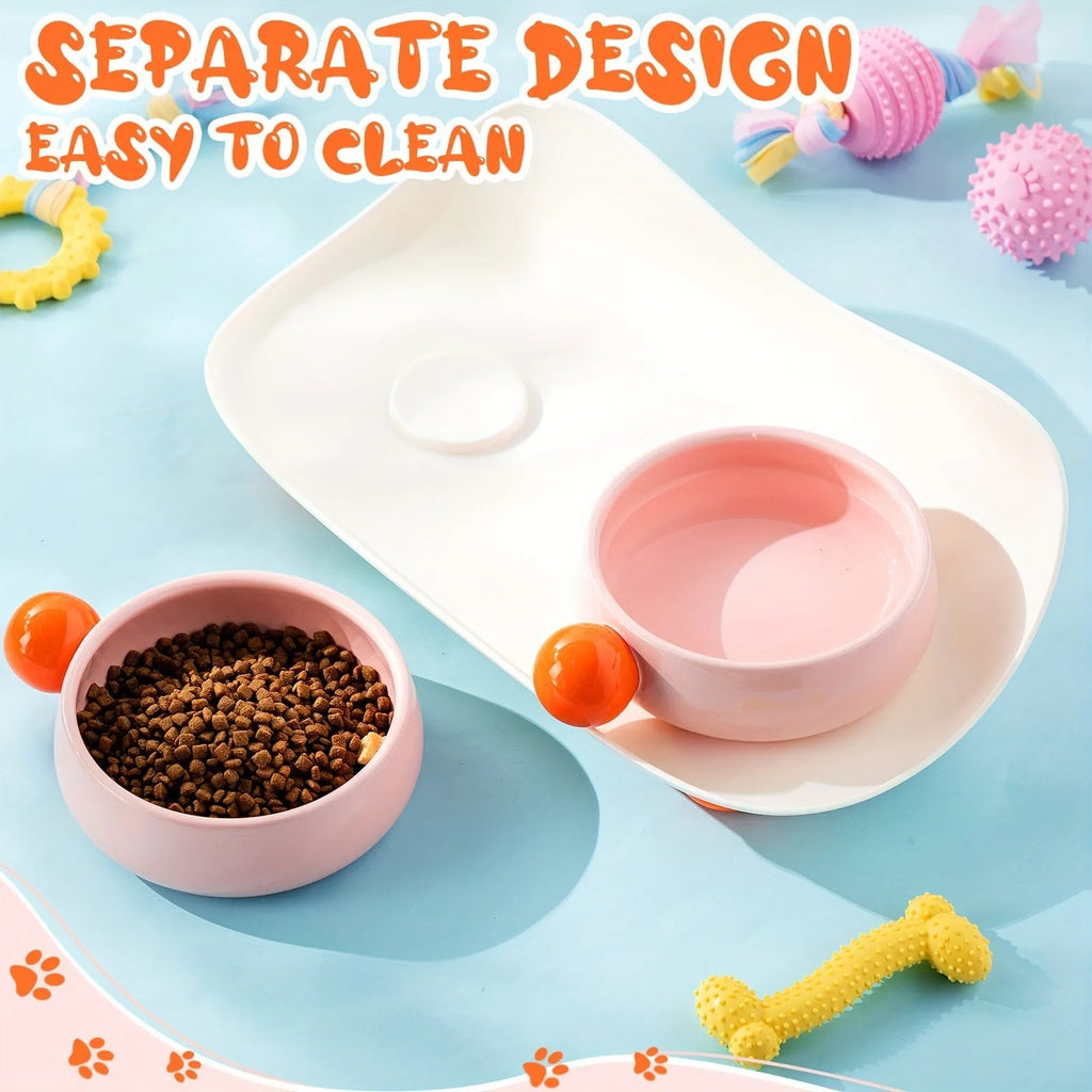 Pink and yellow elevated ceramic pet bowl set for food and water on a non-slip base.